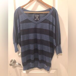 Lighter blue  and darker blue striped Guess shirt with a V-neck and 3/4 sleeves.